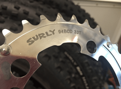 Surly Stainless Steel Outer Chainring - close up ring and tooth detail - tires in background