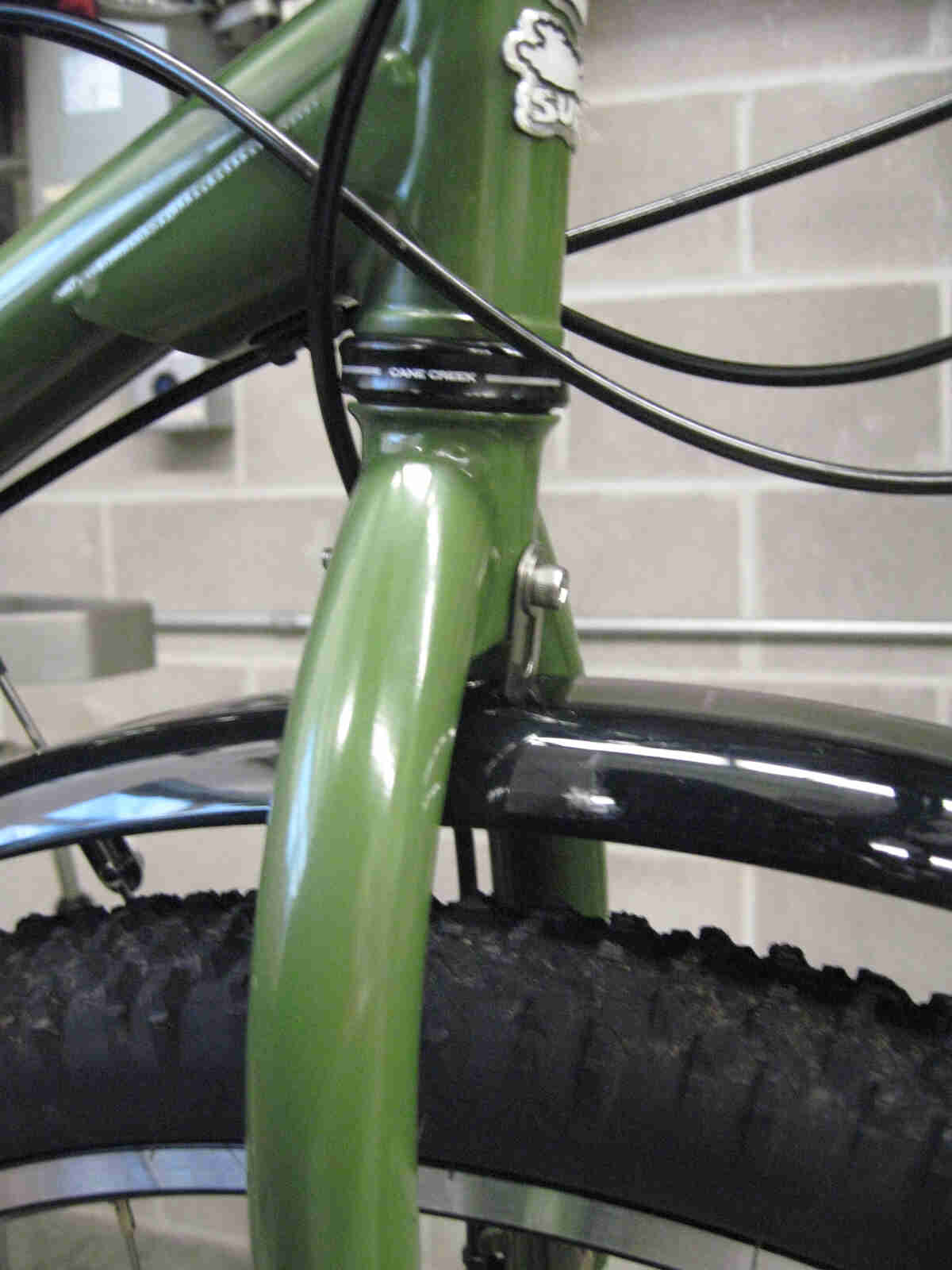 Surly Ogre bike - green - fork, front fender mounting detail - right side, close up view