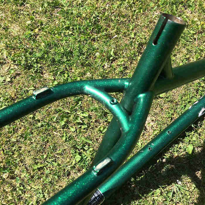 Downward close up view of the seatstay and seat tube of a Surly Krampus bike frame, green