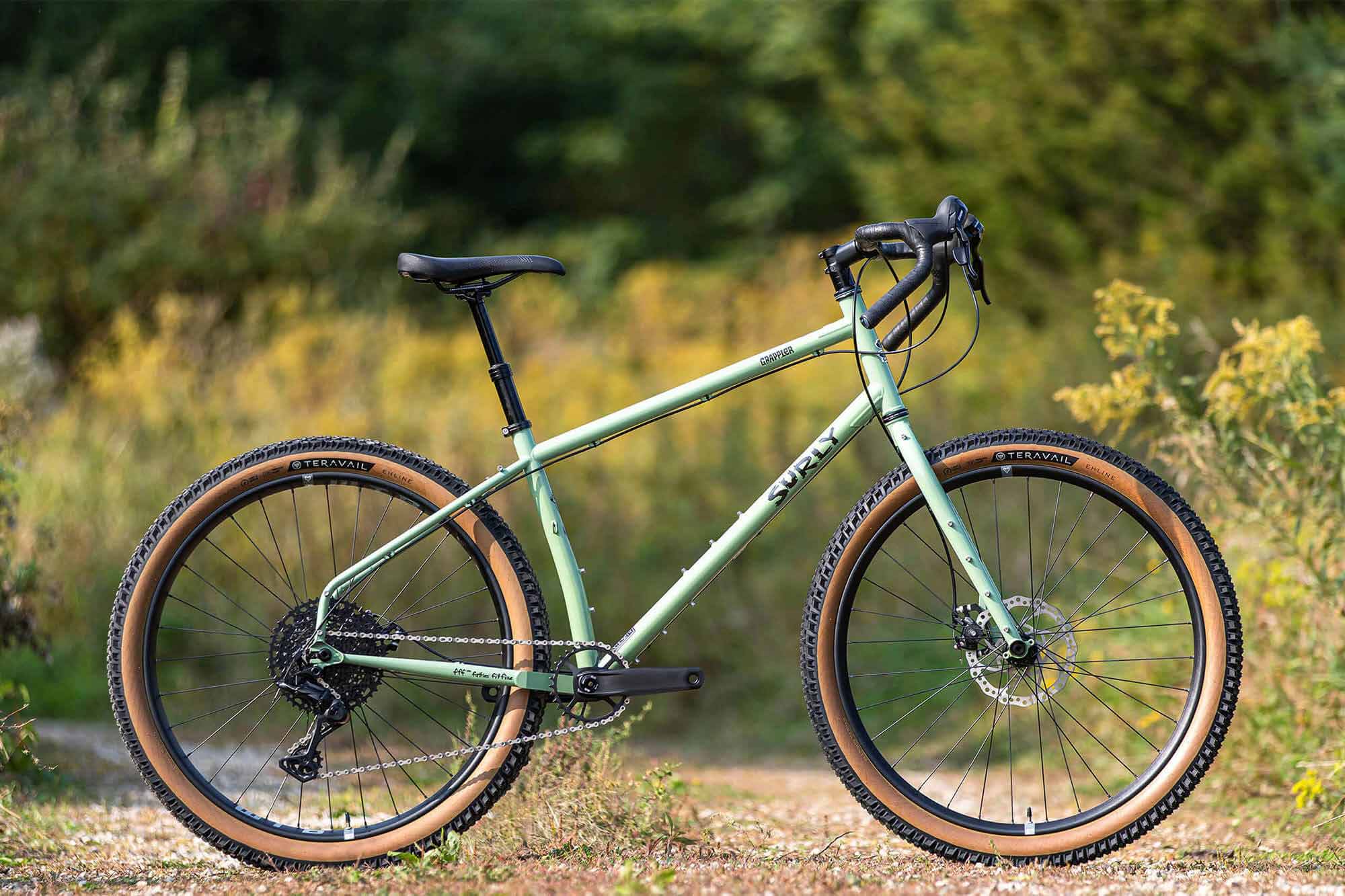 Surly Grappler bike side view outside on gravel road