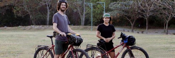 Andrea and Jake with their red Surly Bridge Clubs