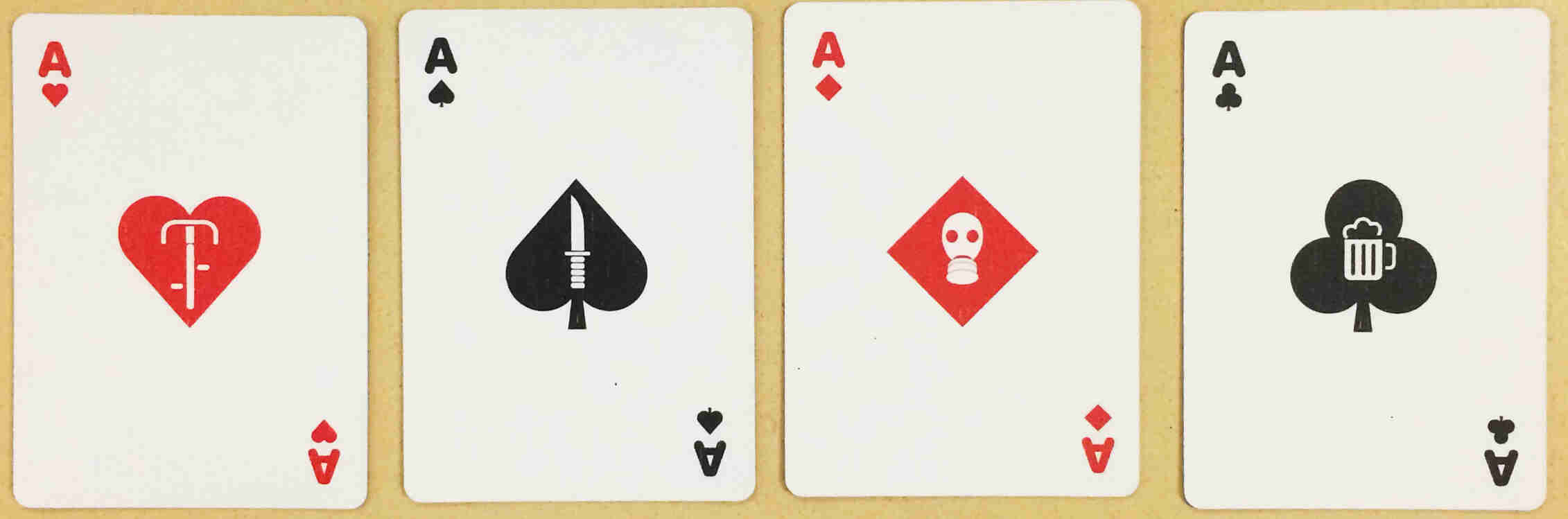 Downward view of two Surly playing cards - One is an Ace of hearts and the other an Ace of spades