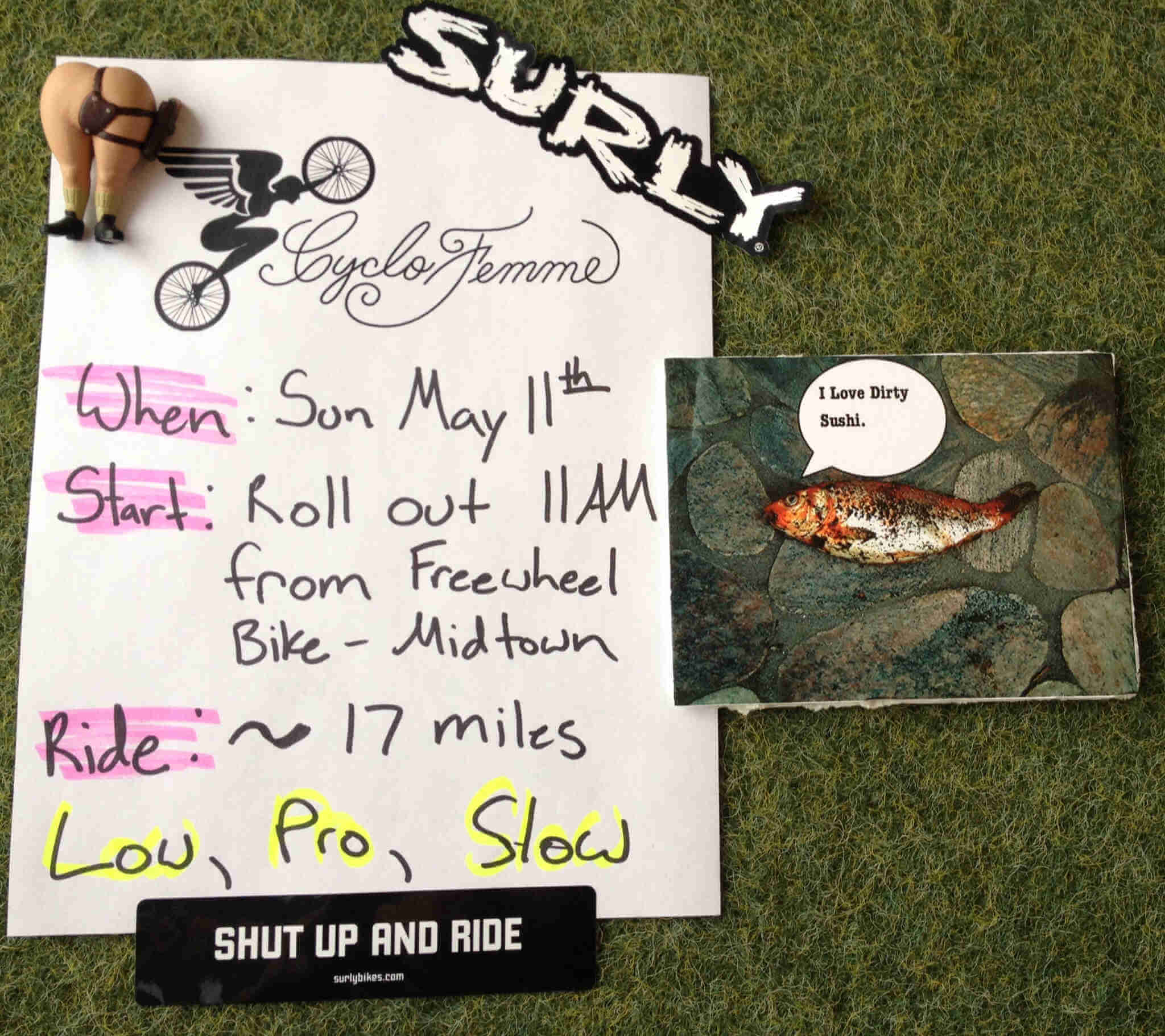 Downward view of a flyer for the Cyclofemme Surly bike event, on white paper, with written text and a Cyclofemme logo