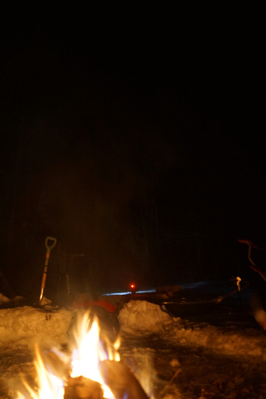 Looped GIF of a campfire in the snow at night