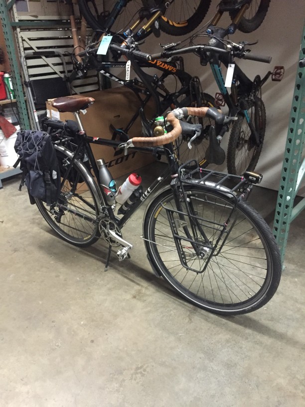 Right side view of a black bike, parked on a warehouse floor