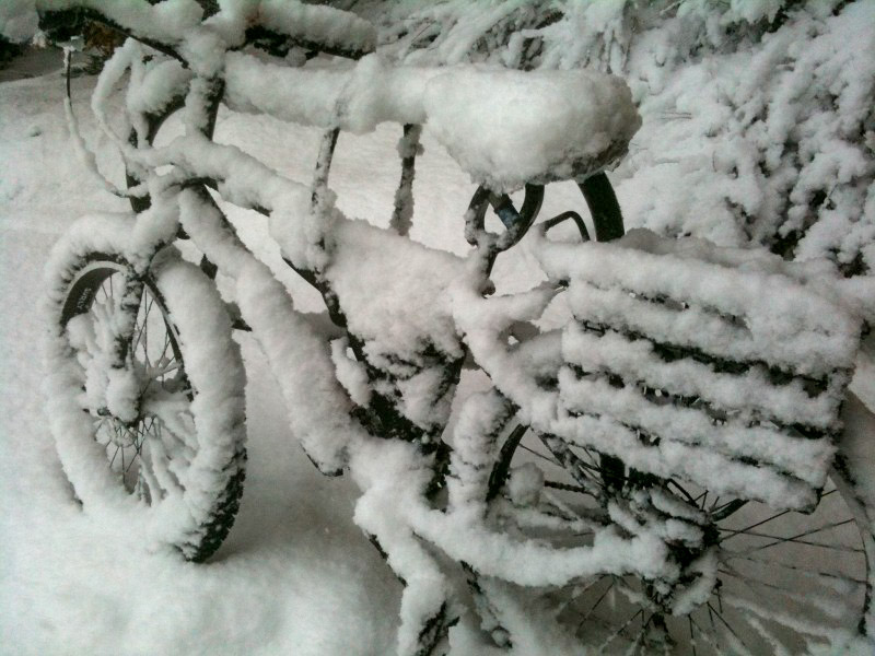 A Surly fat bike completely covered with snow