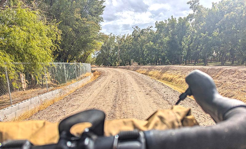 Gravel road view from behind handlebars